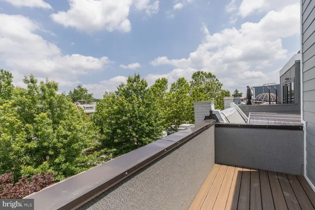 a view of balcony with wooden floor and city view