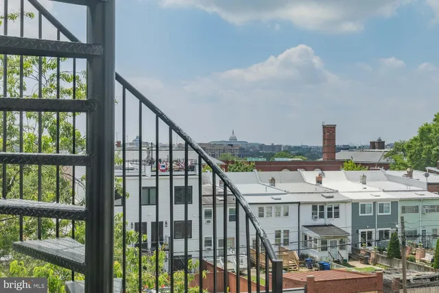 a view of balcony with furniture