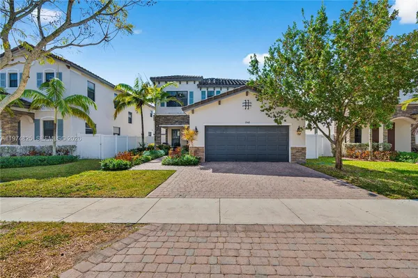 a front view of house with yard and green space