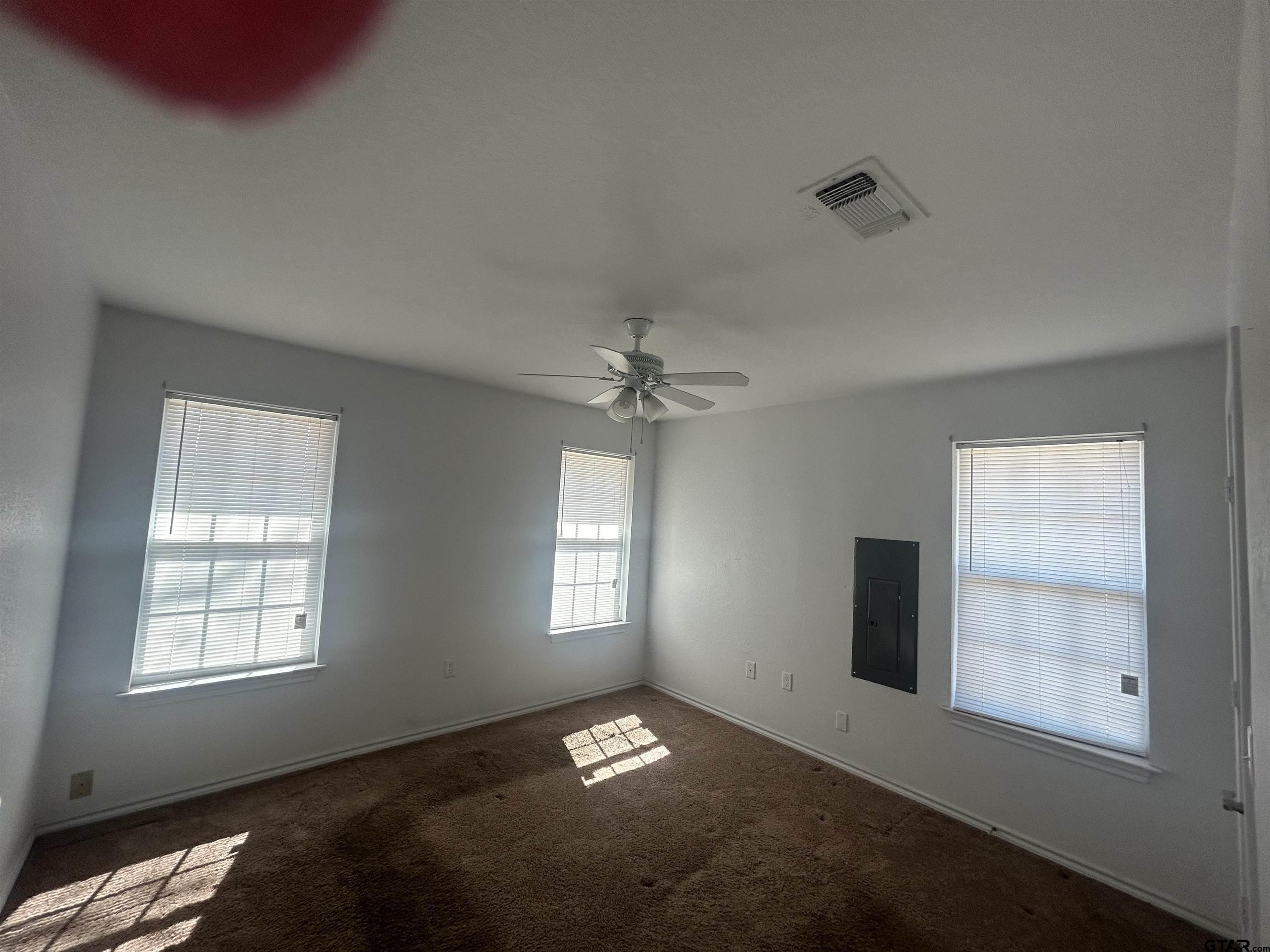803 Sims Avenue Jacksonville, TX 75766 - Photo 12 of 18 an empty room with windows and closet