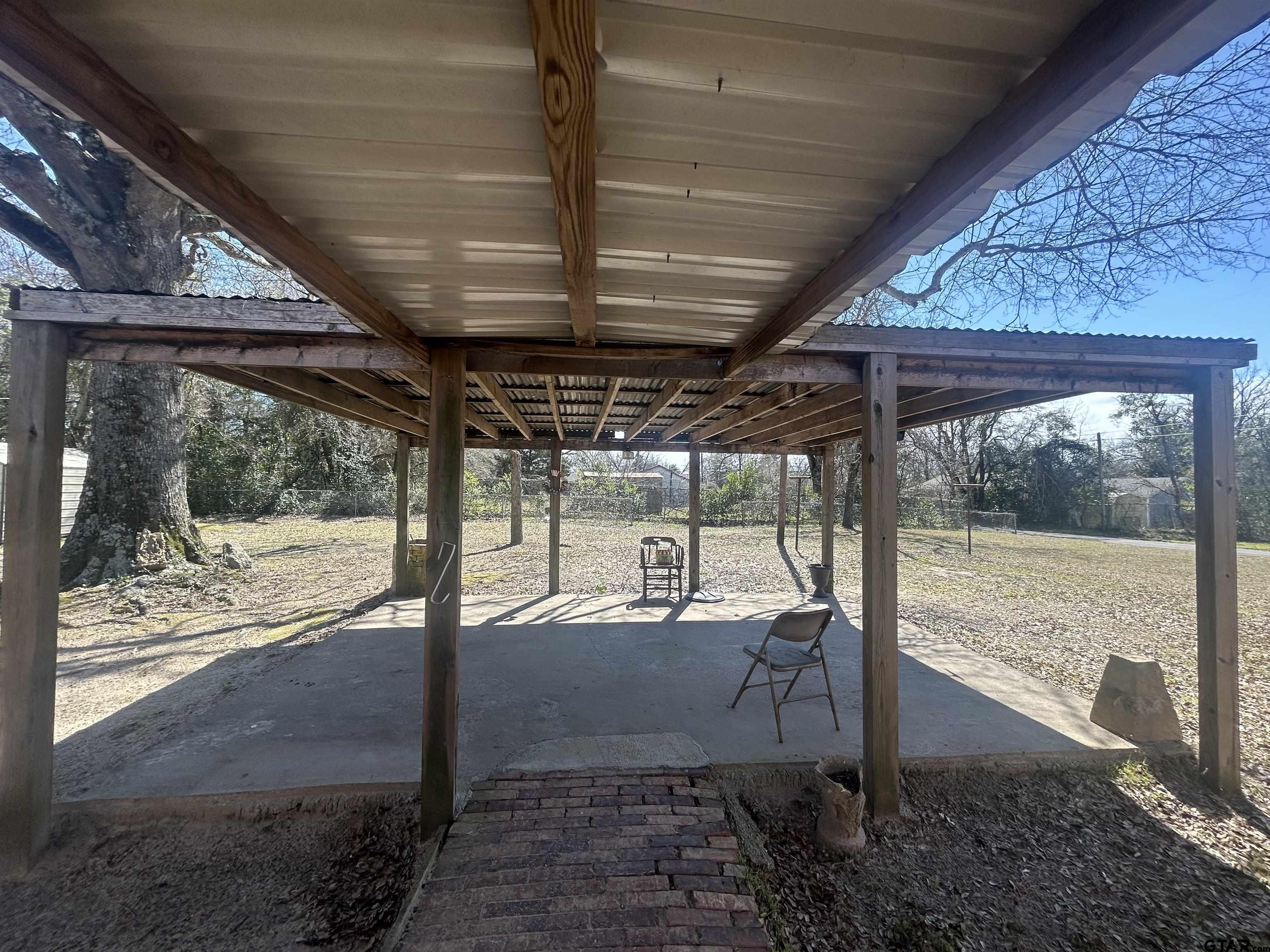 803 Sims Avenue Jacksonville, TX 75766 - Photo 13 of 18 a view of a room with wooden floor