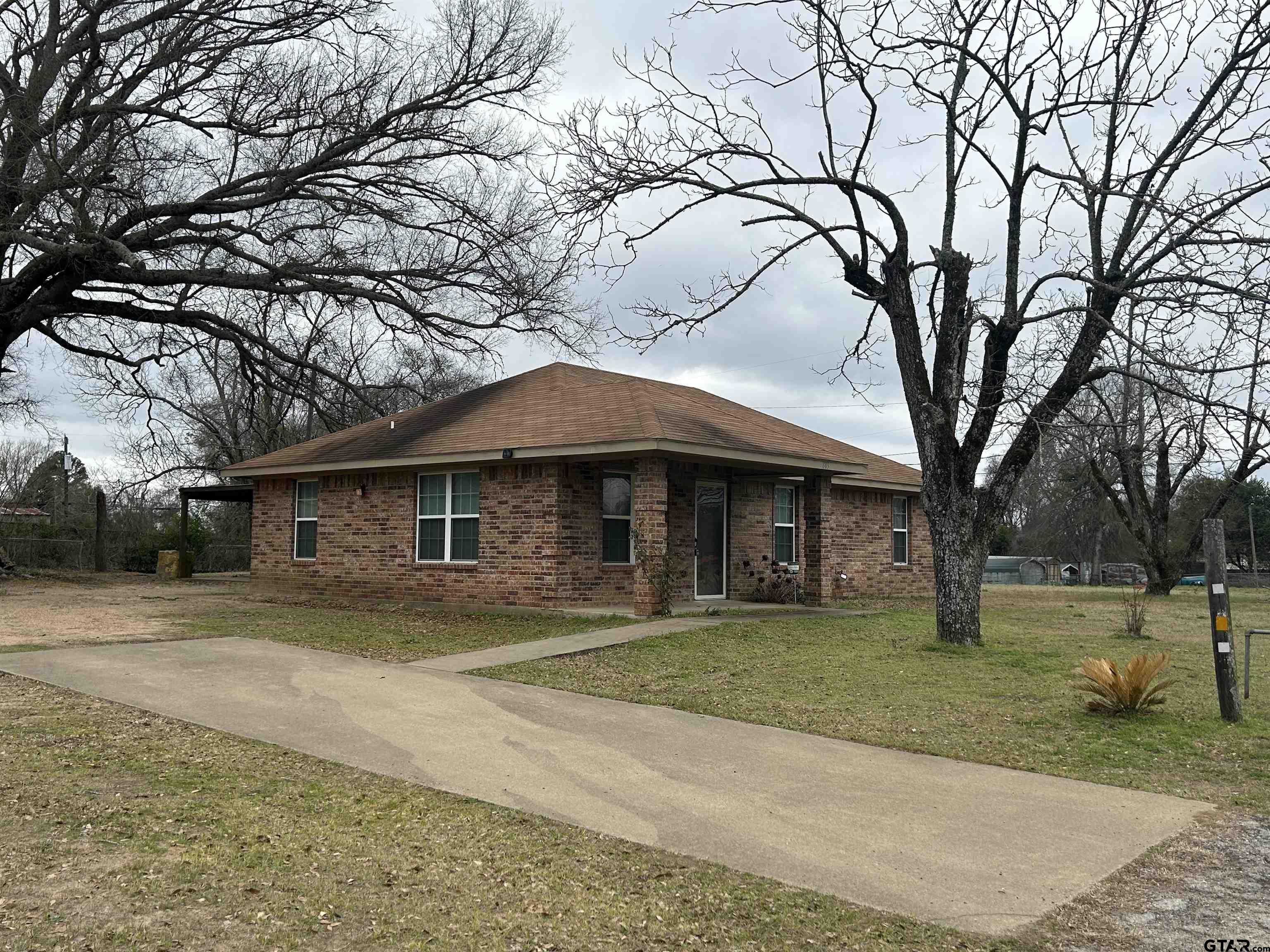 803 Sims Avenue Jacksonville, TX 75766 - Photo 18 of 18 a front view of a house with a yard