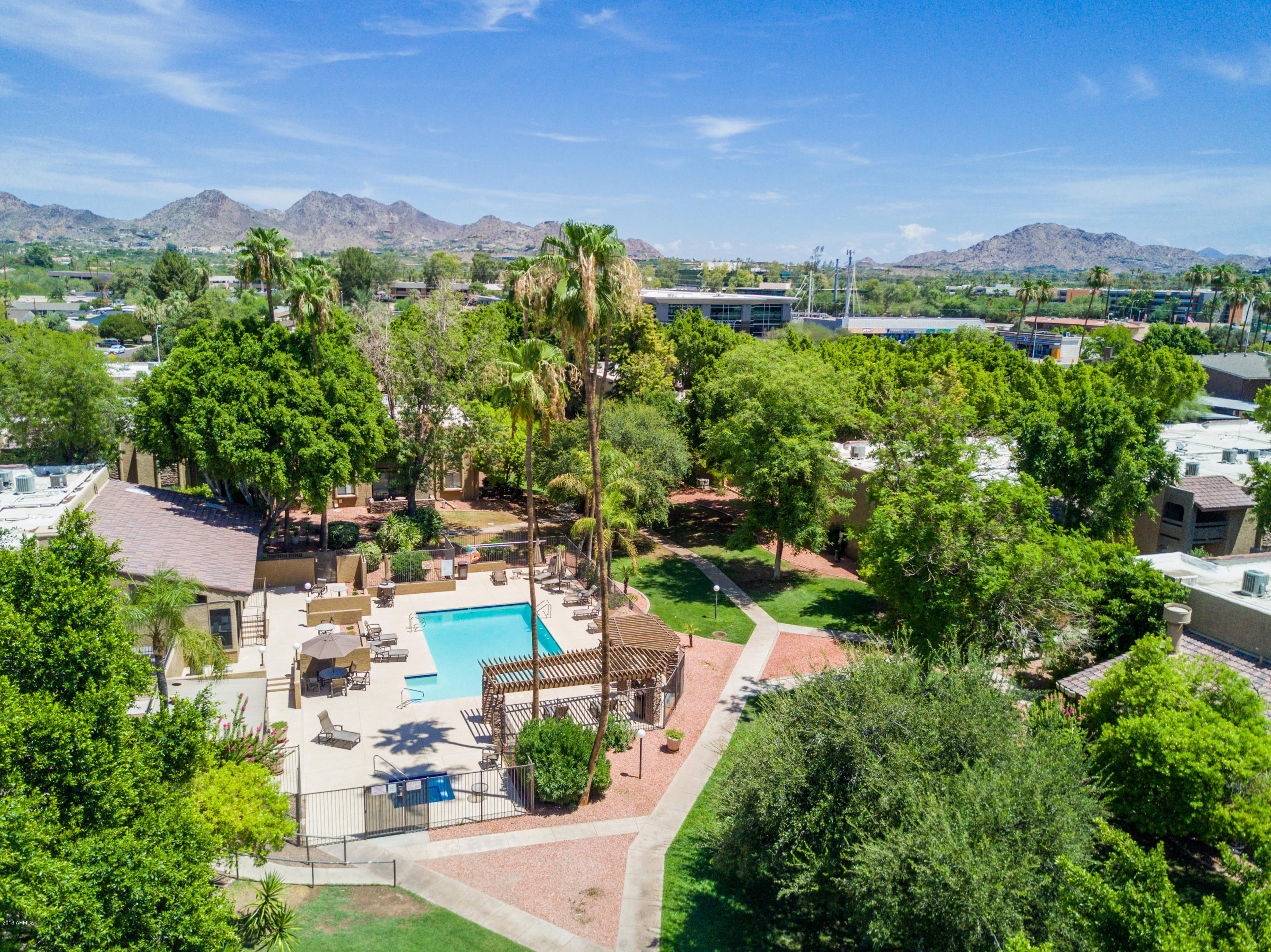 an aerial view of a house with a yard and lake view