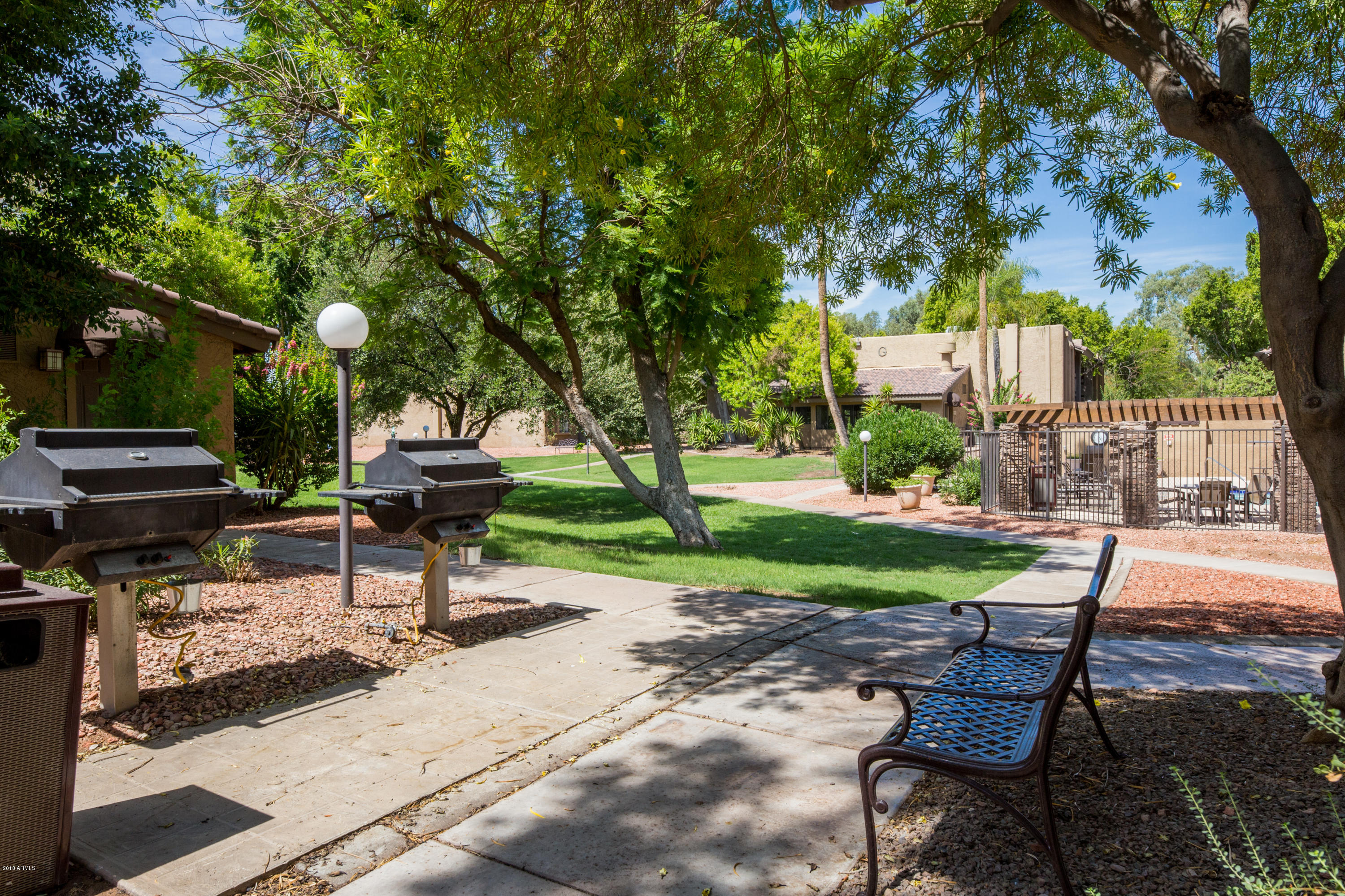3825 East Camelback Road, Unit 249 Phoenix, AZ 85018 - Photo 19 of 30 a view of a backyard with sitting area
