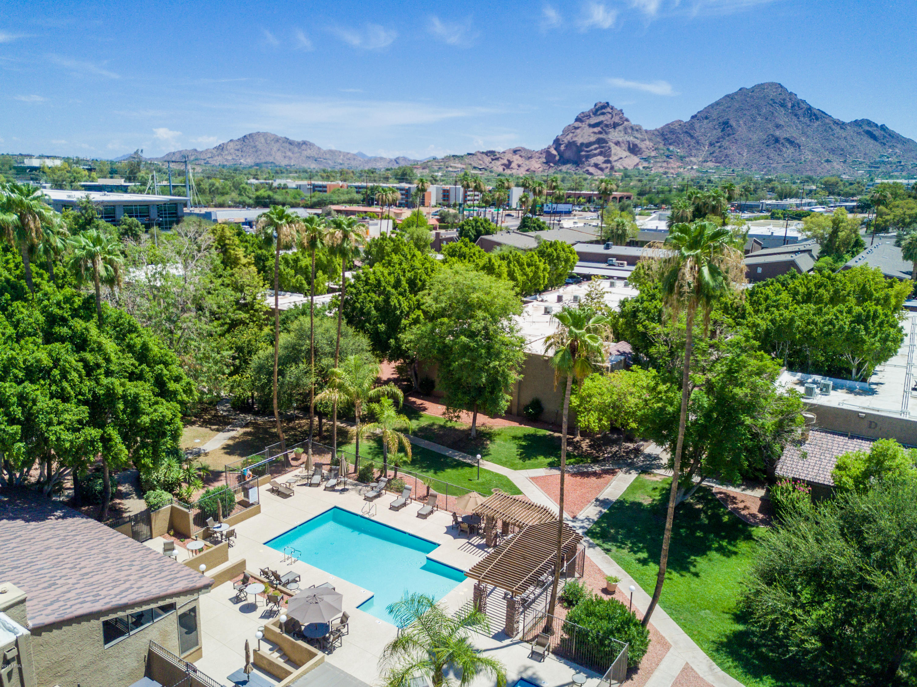 3825 East Camelback Road, Unit 249 Phoenix, AZ 85018 - Photo 2 of 30 a view of a house with a garden