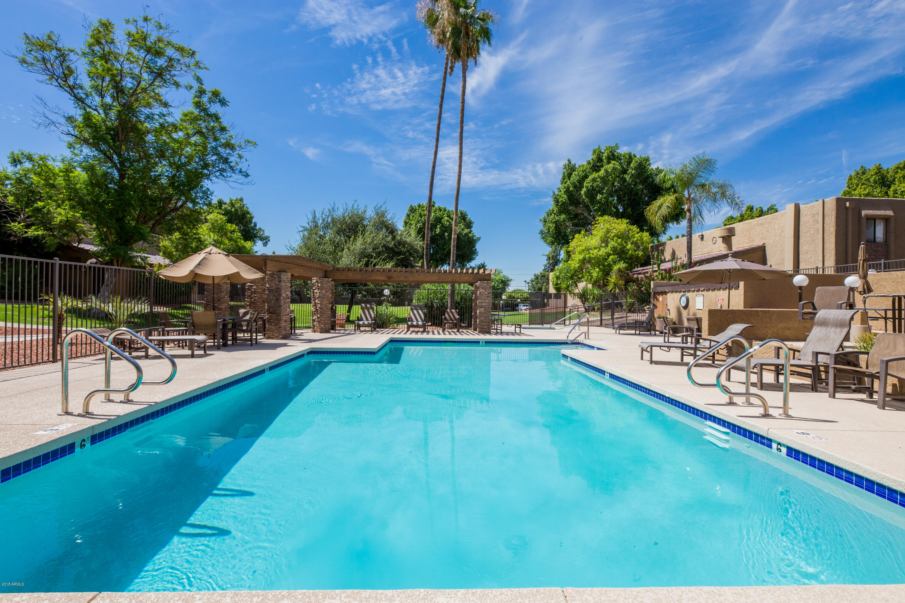3825 East Camelback Road, Unit 249 Phoenix, AZ 85018 - Photo 23 of 30 a view of a swimming pool with a patio
