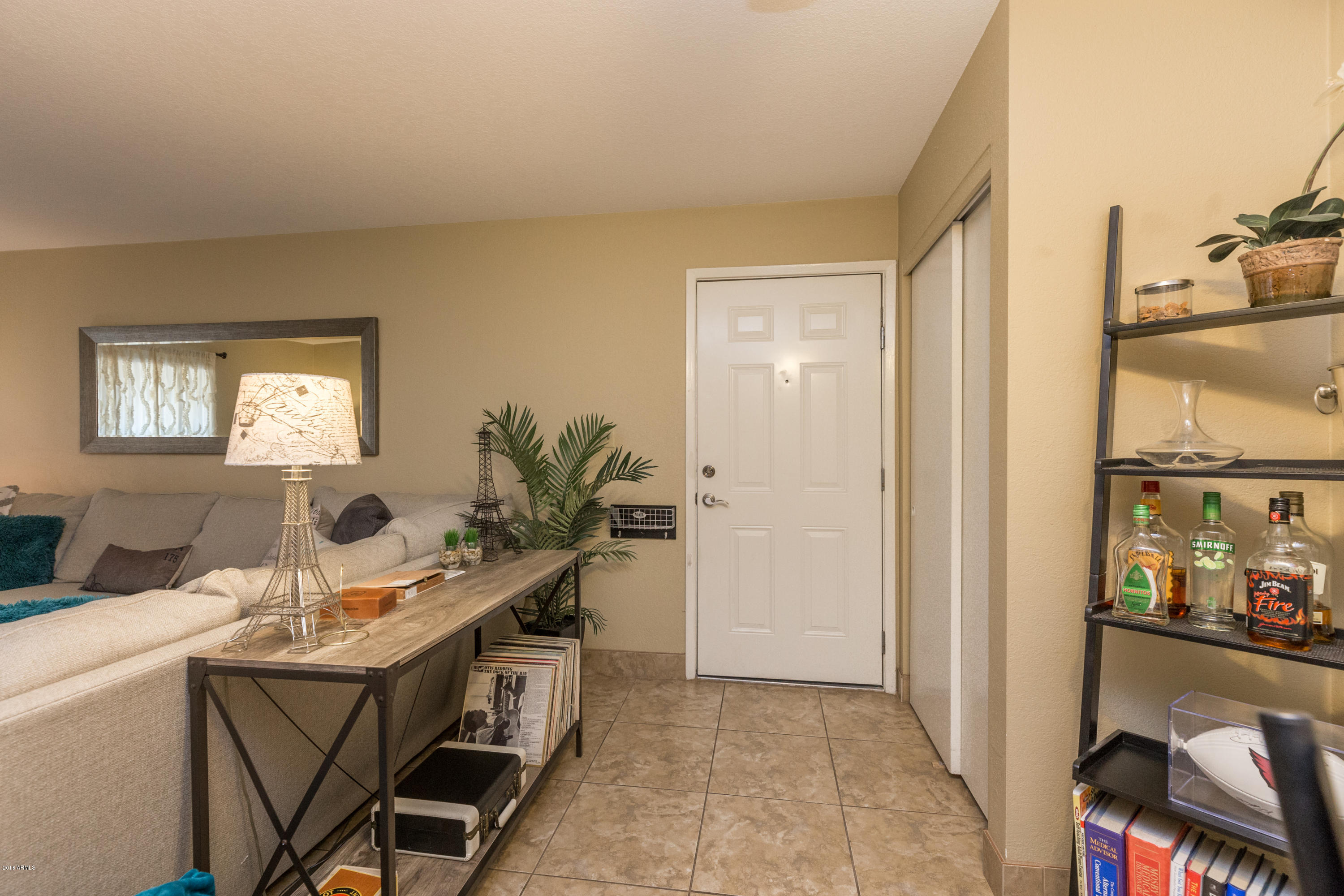 3825 East Camelback Road, Unit 249 Phoenix, AZ 85018 - Photo 6 of 30 a view of a workspace with furniture and a window
