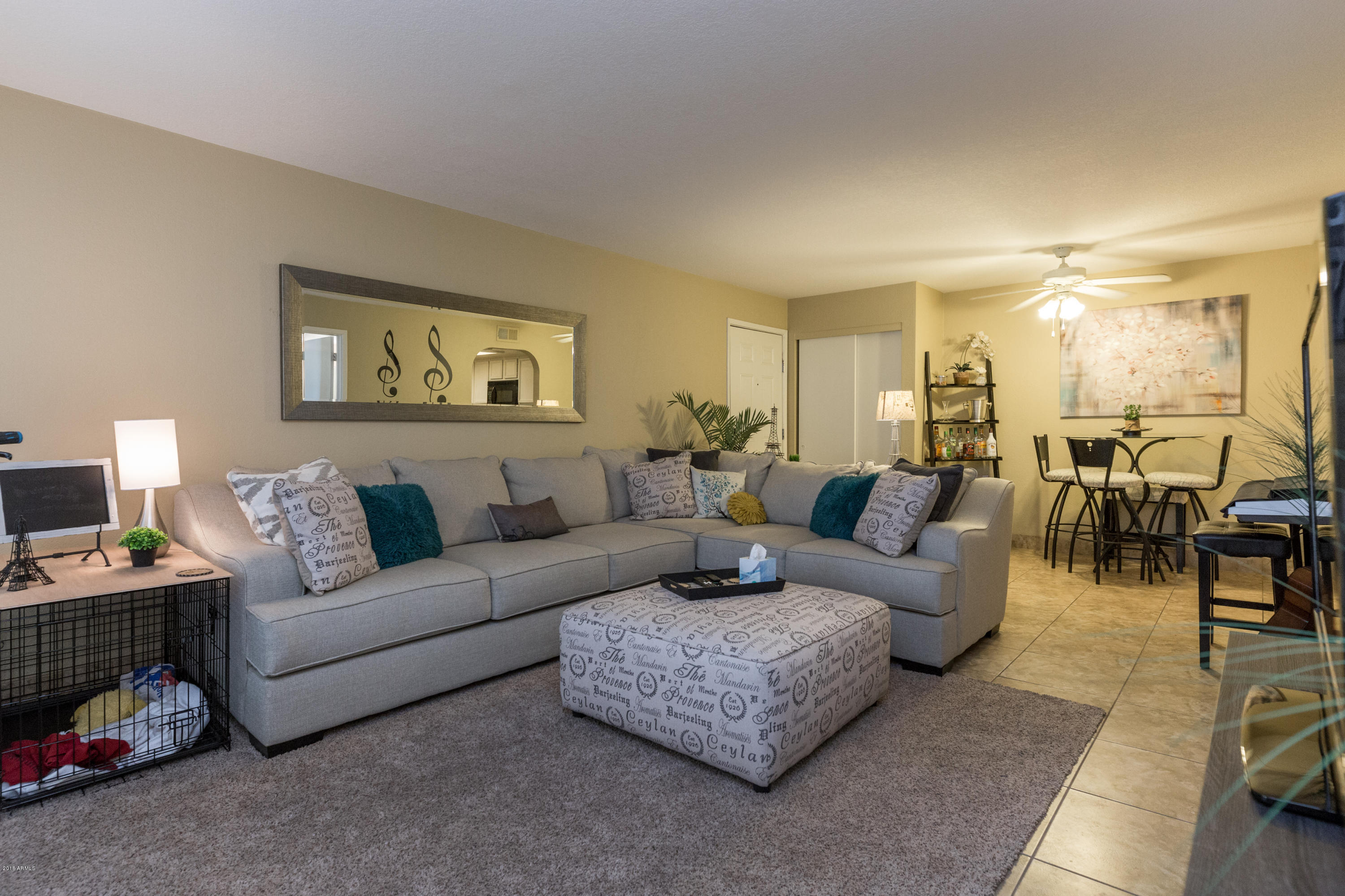 3825 East Camelback Road, Unit 249 Phoenix, AZ 85018 - Photo 10 of 30 a living room with furniture and a night stand