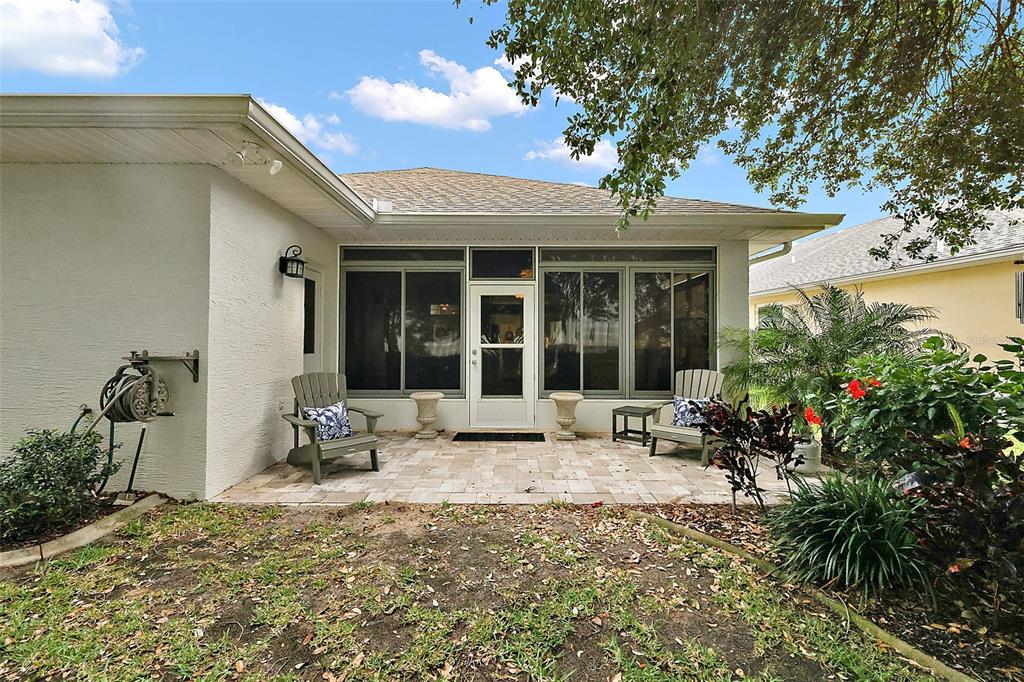 3584 Tropical Seas Loop Tavares, FL 32778 - Photo 34 of 49 a view of a house with sitting area and garden