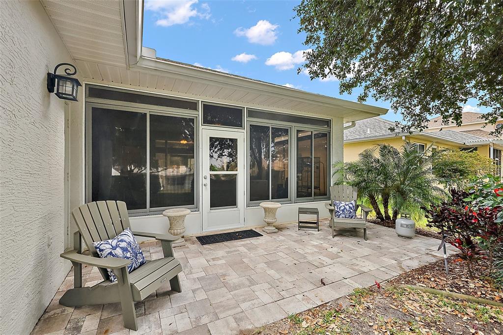 3584 Tropical Seas Loop Tavares, FL 32778 - Photo 35 of 49 a building outdoor space with patio furniture and potted plants