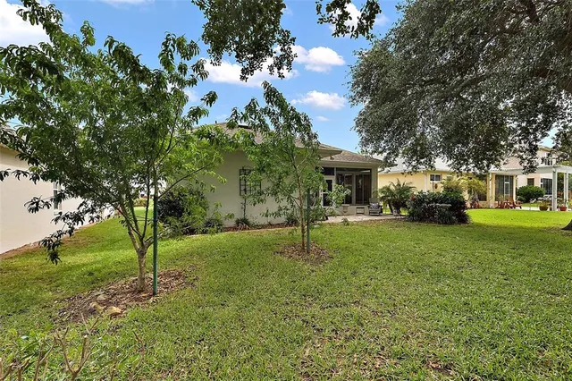 a aerial view of multiple houses with a yard