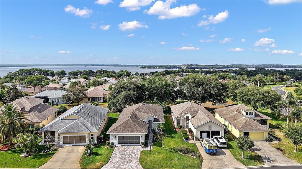 3584 Tropical Seas Loop Tavares, FL 32778 - Photo 49 of 49 a aerial view of multiple houses with a yard