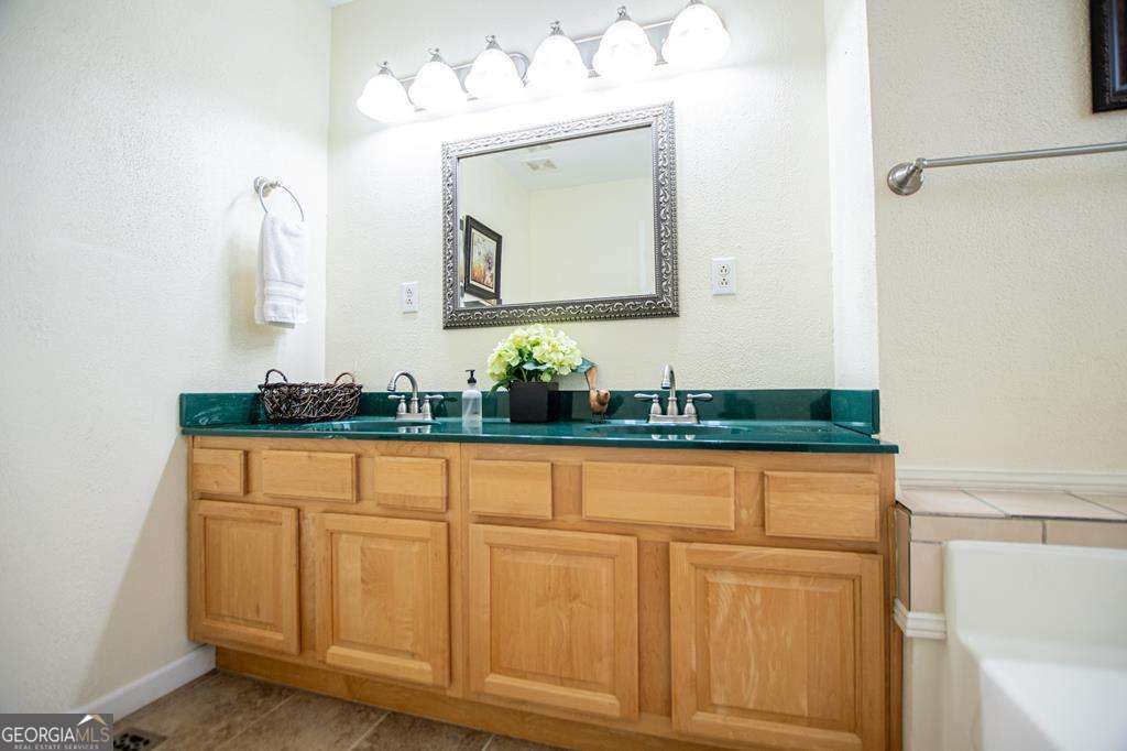2 Pine Hill Drive Ranburne, AL 36273 - Photo 44 of 91 a bathroom with a sink and a mirror