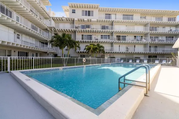 a view of swimming pool with a patio