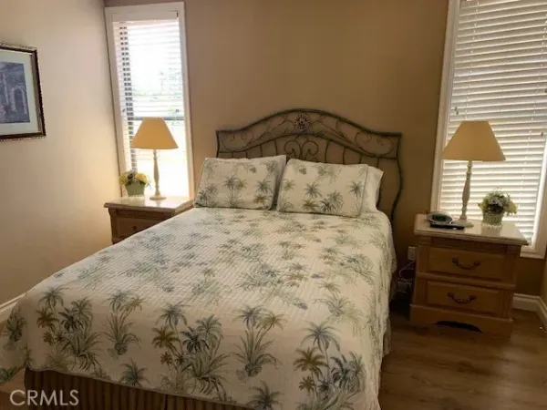 a front view of a house with porch and furniture