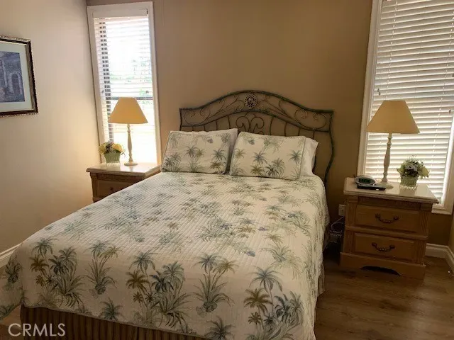 a front view of a house with porch and furniture