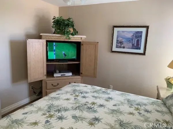 a view of a garden with a building in the background