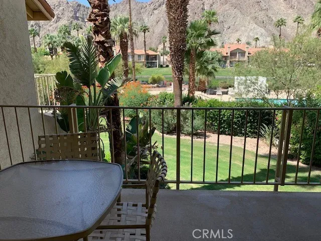 a front view of a house with a garden and yard