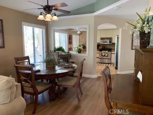 a kitchen with stainless steel appliances granite countertop a stove a refrigerator and a microwave