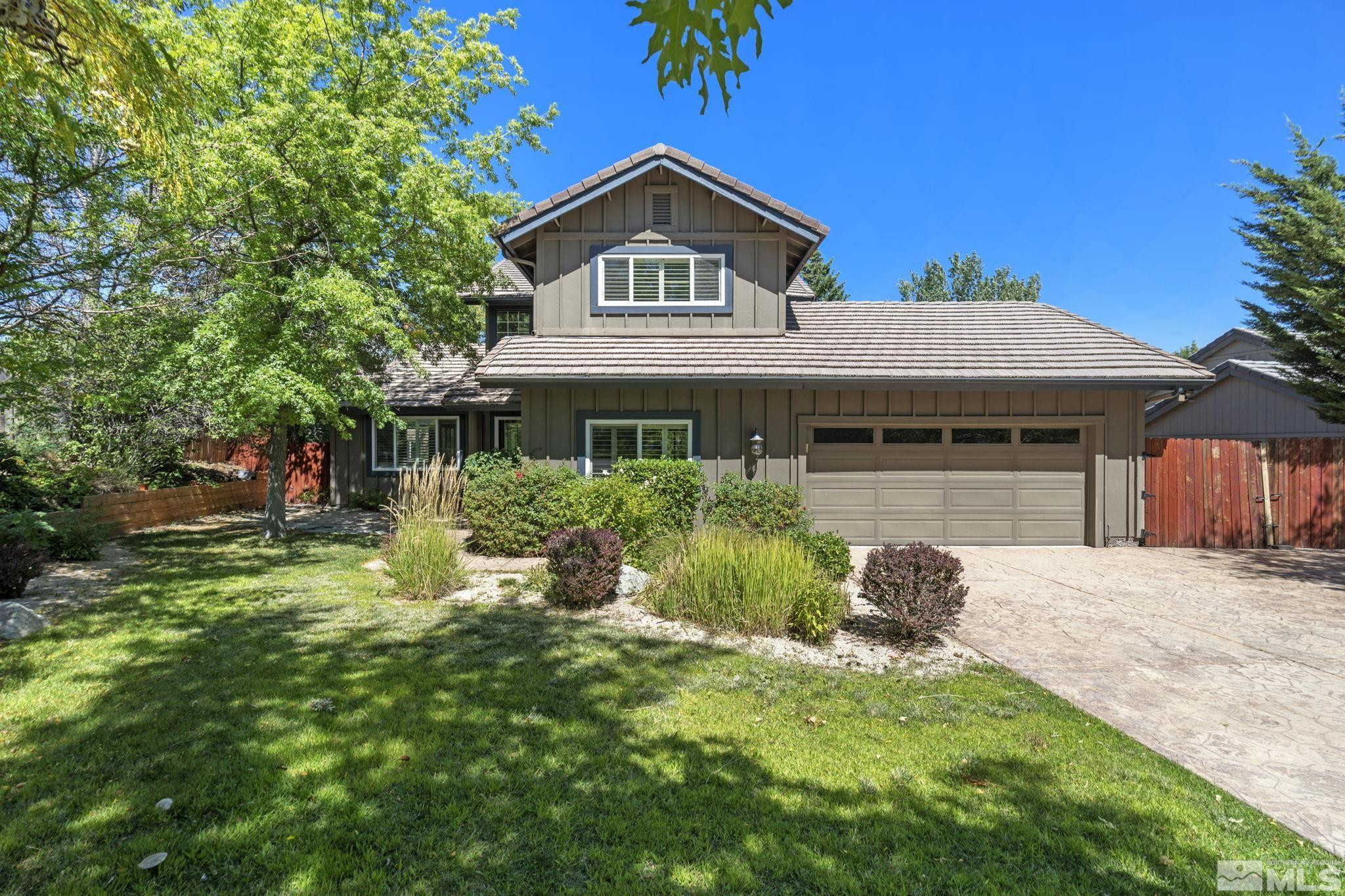 2197 Solitude Drive Reno, NV 89511 - Photo 2 of 40 a front view of a house with a yard