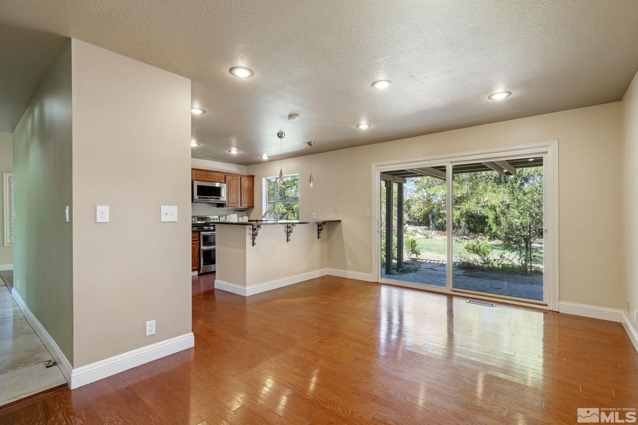 2197 Solitude Drive Reno, NV 89511 - Photo 23 of 40 a view of kitchen with furniture and wooden floor