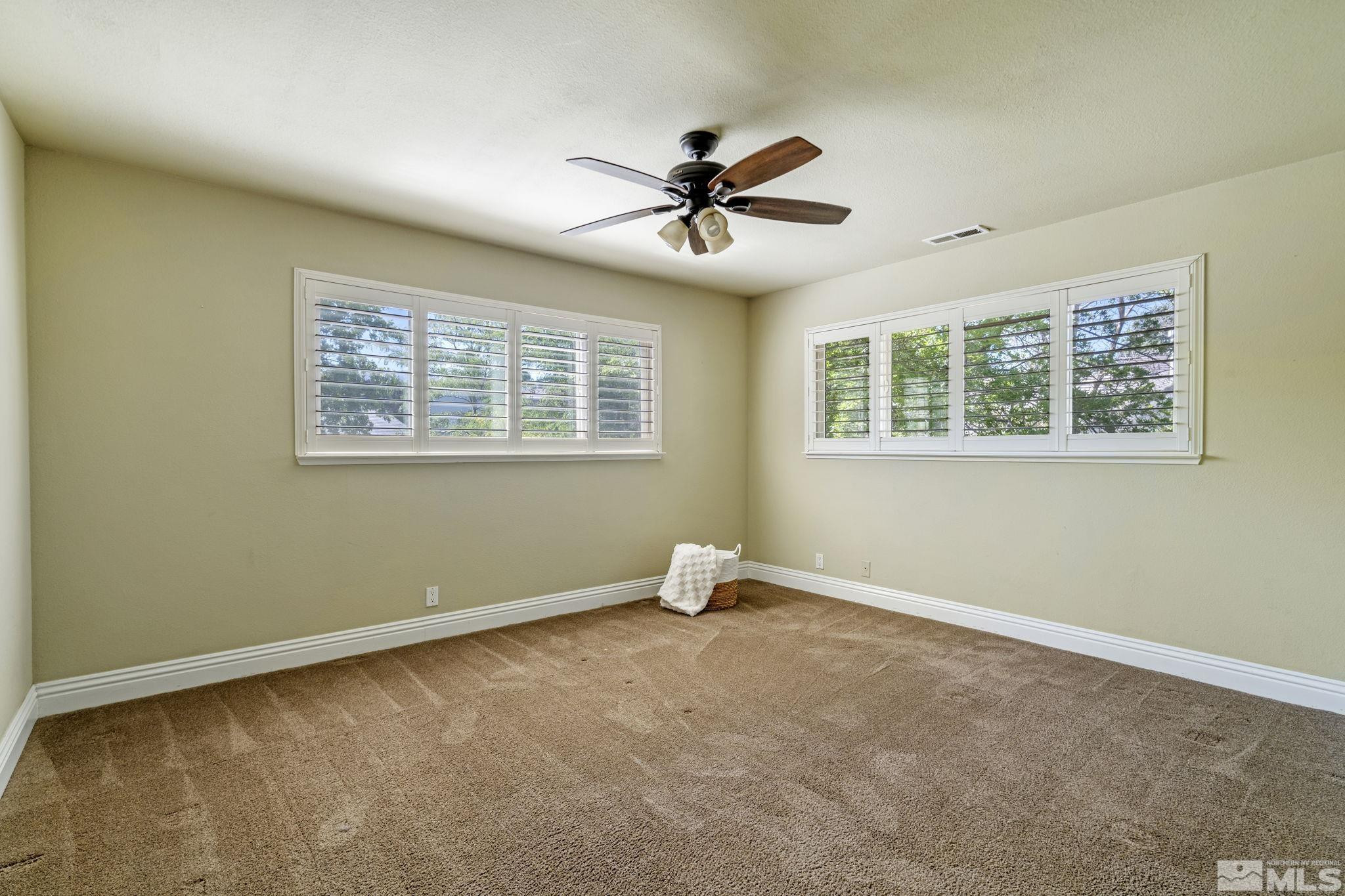 2197 Solitude Drive Reno, NV 89511 - Photo 29 of 40 a view of an empty room with a window