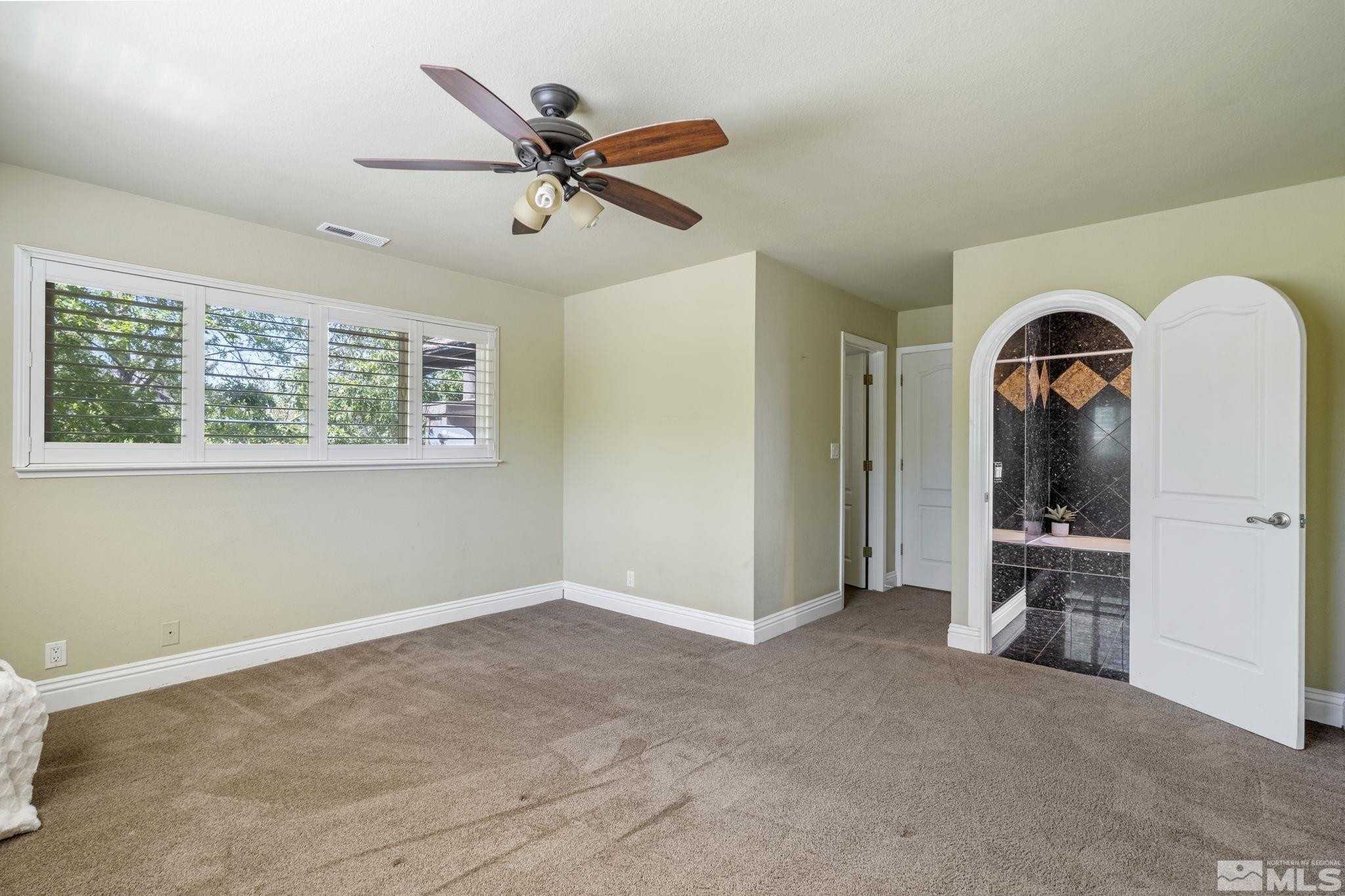 2197 Solitude Drive Reno, NV 89511 - Photo 30 of 40 a view of an empty room with a window