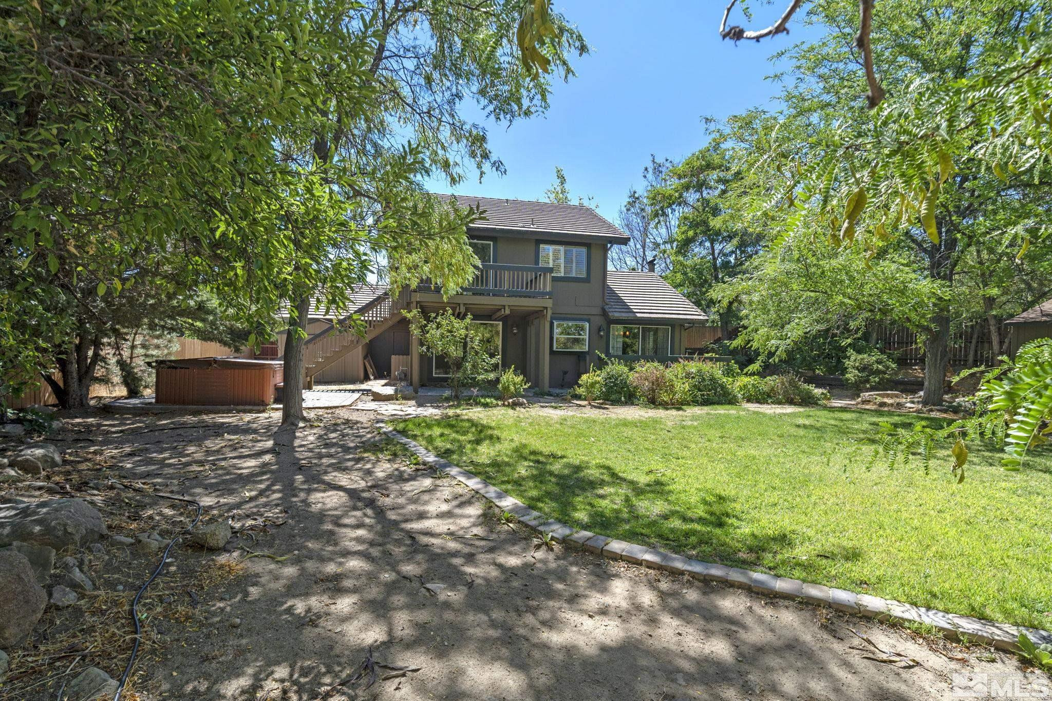 2197 Solitude Drive Reno, NV 89511 - Photo 37 of 40 a front view of a house with a yard