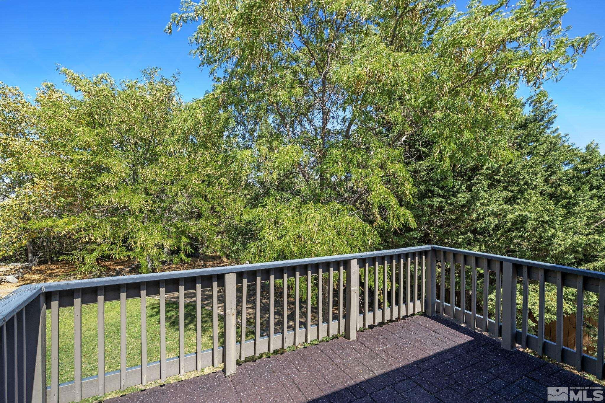 2197 Solitude Drive Reno, NV 89511 - Photo 39 of 40 a balcony with trees in front of it