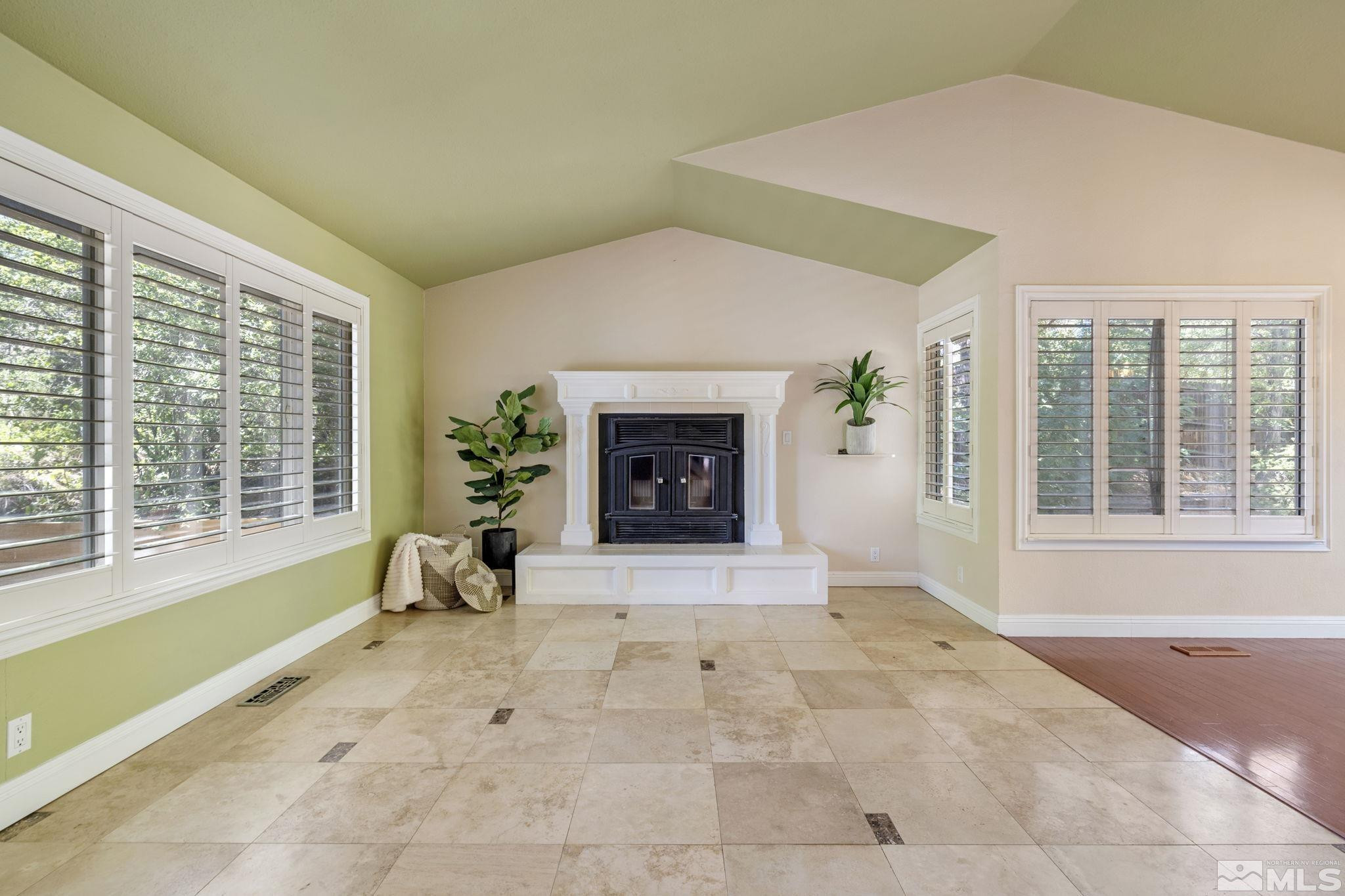 2197 Solitude Drive Reno, NV 89511 - Photo 7 of 40 a living room with furniture and a fireplace