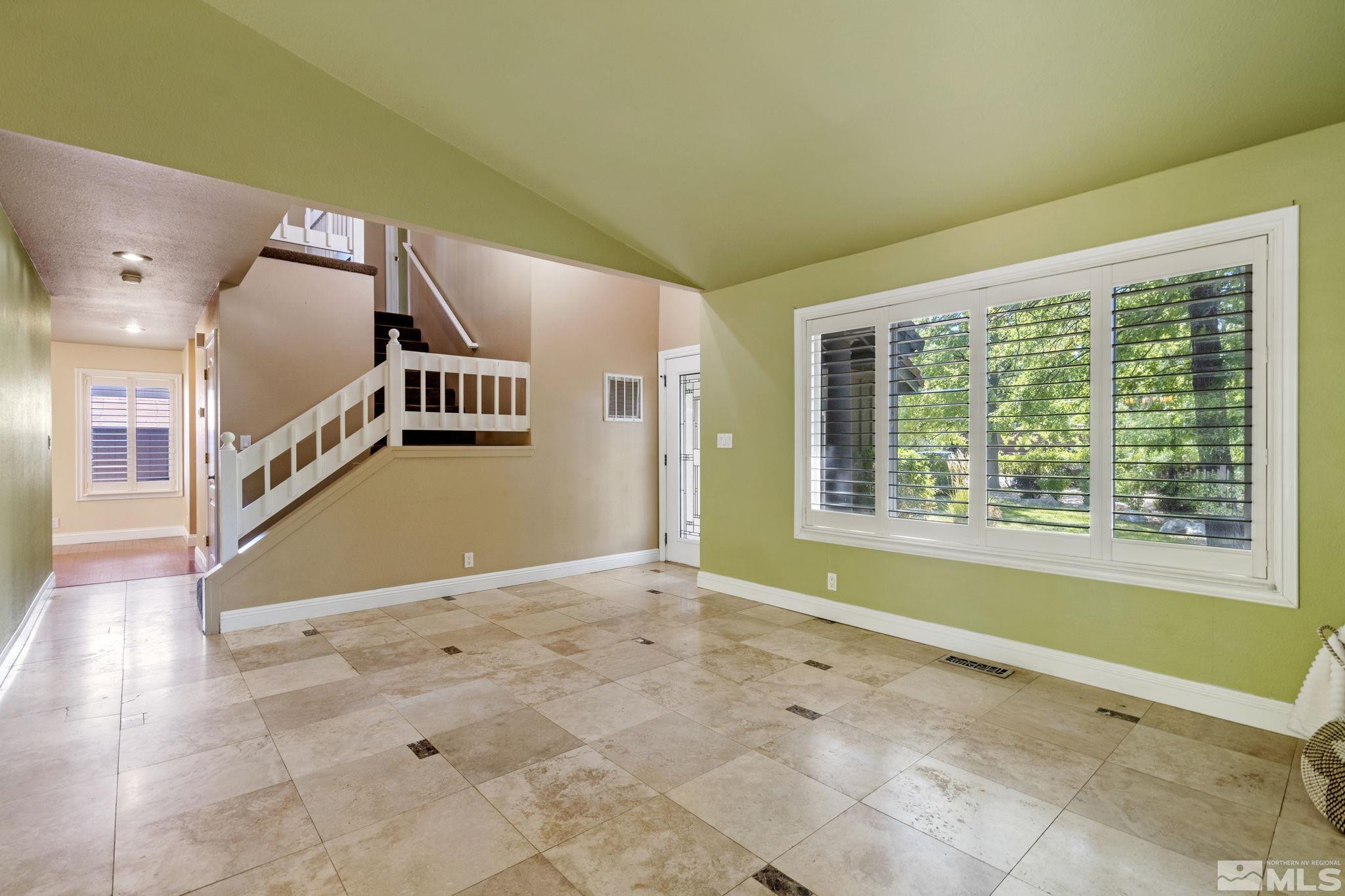 2197 Solitude Drive Reno, NV 89511 - Photo 10 of 40 a view of an empty room with windows