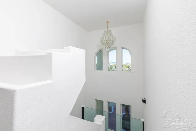 a view of a livingroom with wooden floor and entryway