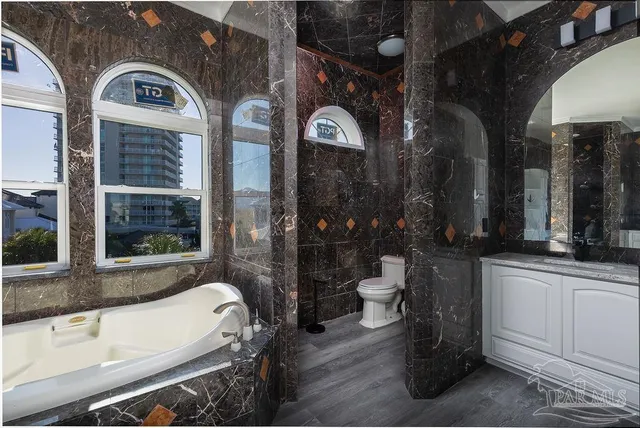 a bathroom with a bathtub and a window