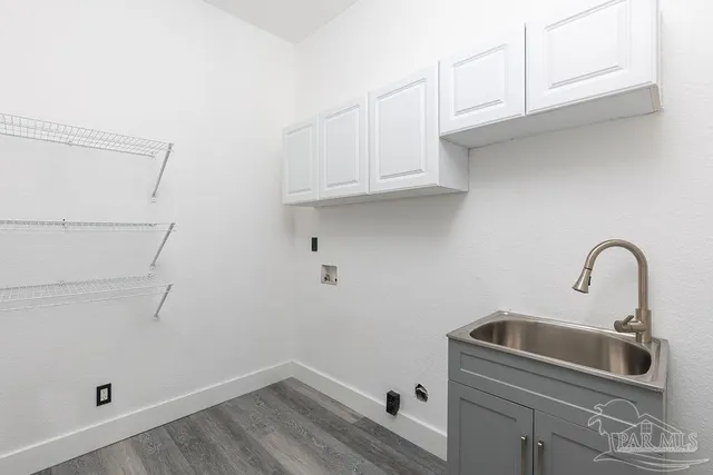 a bathroom with a sink and cabinets