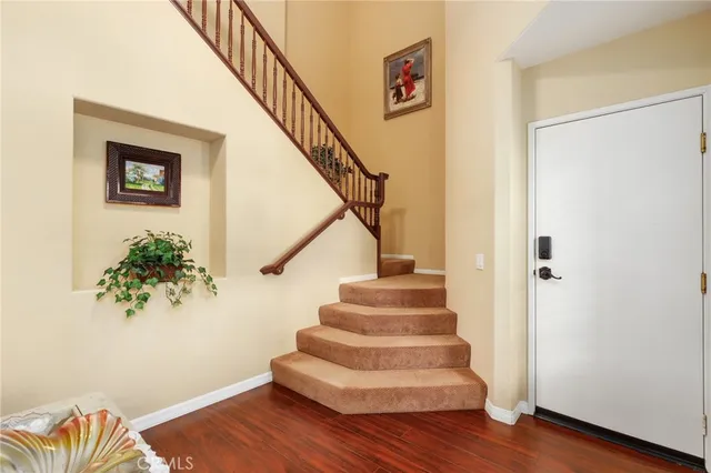 a view of entryway with wooden floor