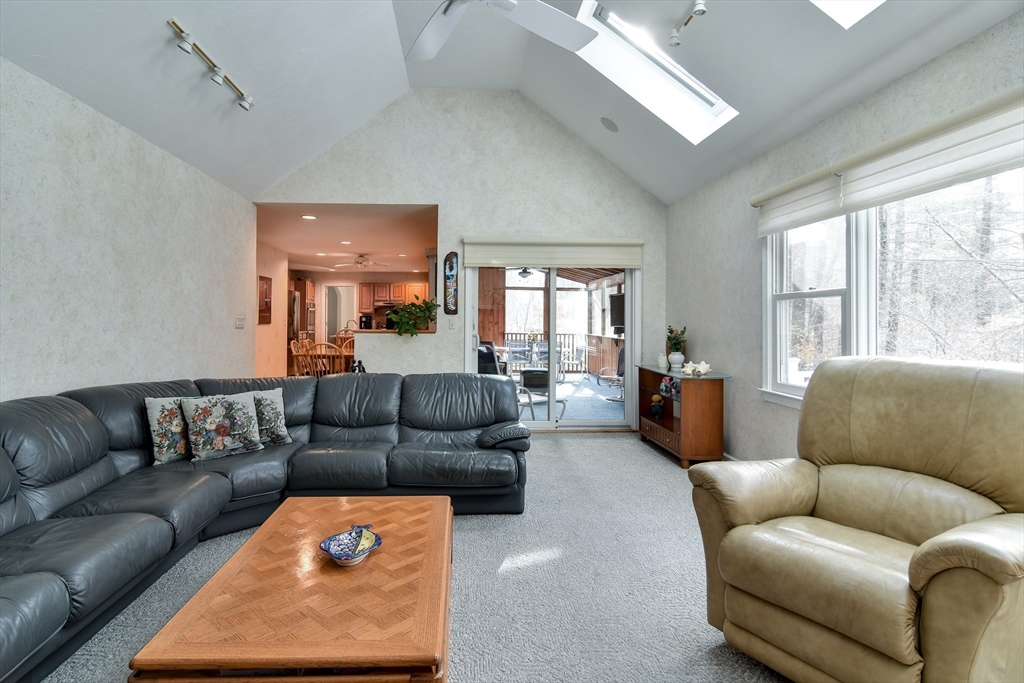 10 Sundance Way Natick, MA 01760 - Photo 15 of 40 a living room with furniture and a couch