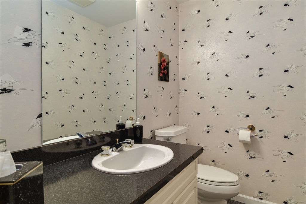 10 Sundance Way Natick, MA 01760 - Photo 18 of 40 a bathroom with a sink toilet and shower