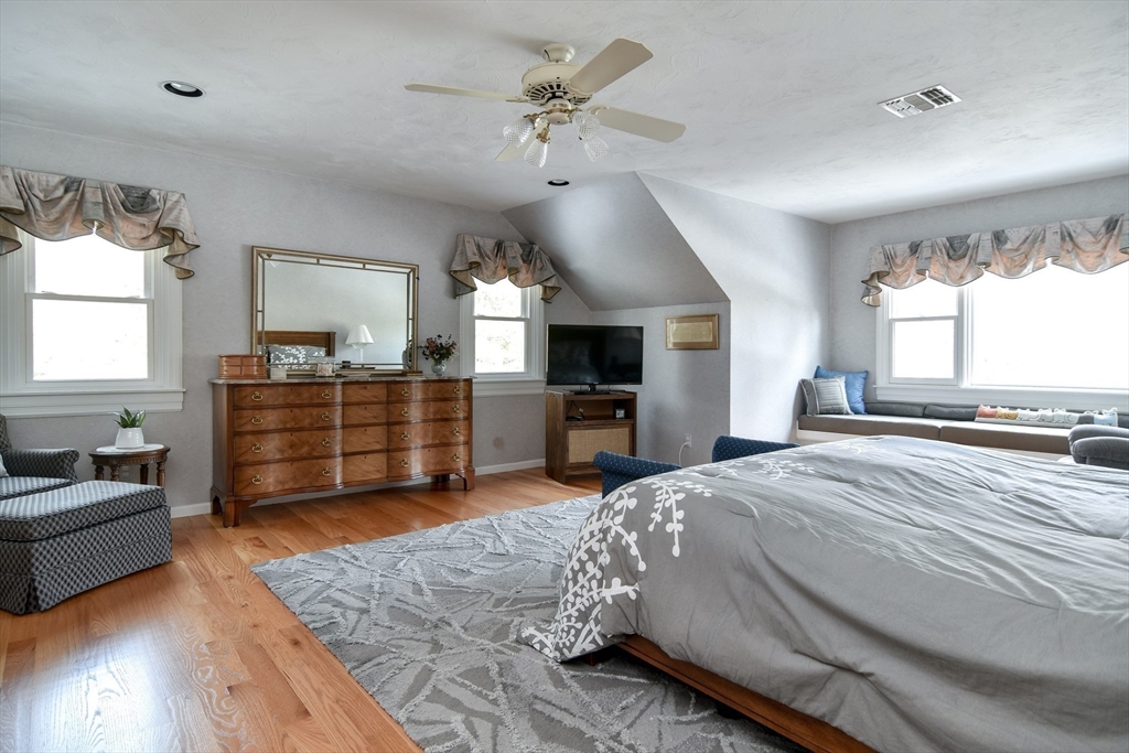 10 Sundance Way Natick, MA 01760 - Photo 24 of 40 a spacious bedroom with a bed and a television