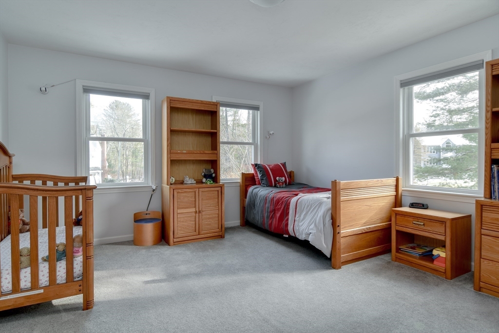 10 Sundance Way Natick, MA 01760 - Photo 28 of 40 a bedroom with a bed and a window