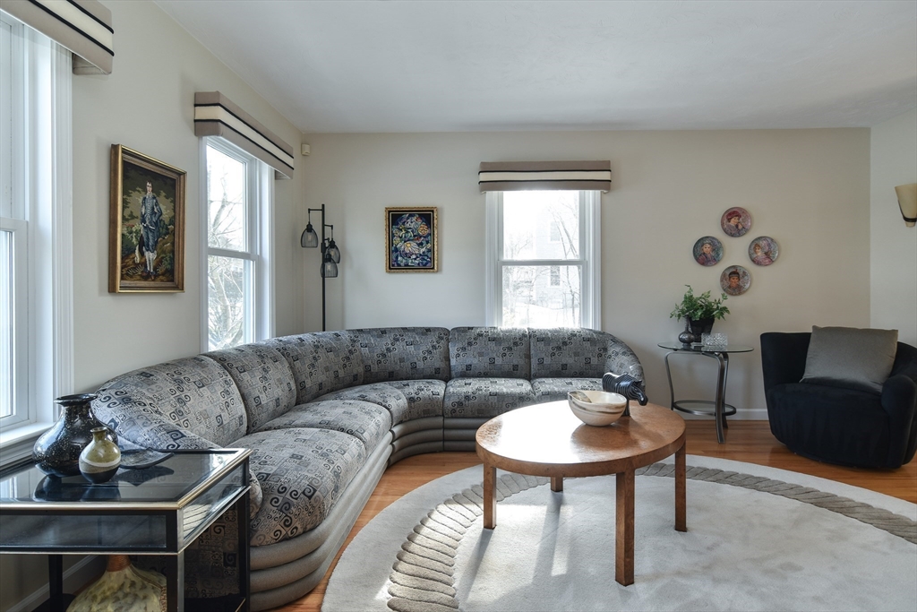 10 Sundance Way Natick, MA 01760 - Photo 3 of 40 a living room with furniture and a potted plant