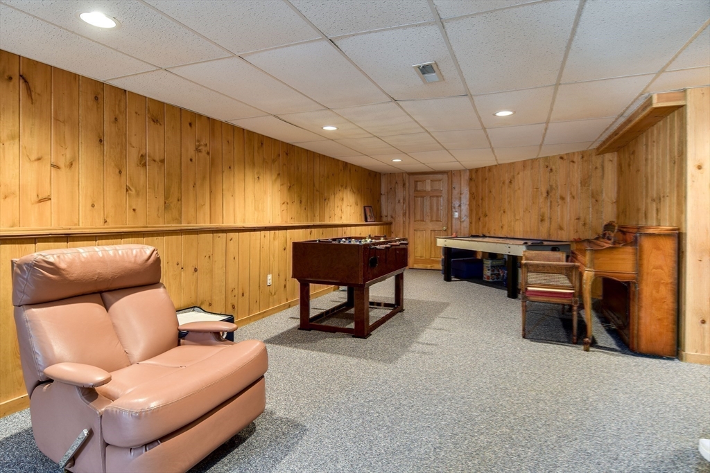 10 Sundance Way Natick, MA 01760 - Photo 33 of 40 a bedroom with furniture and a projector