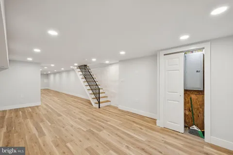 a view of a room with wooden floor