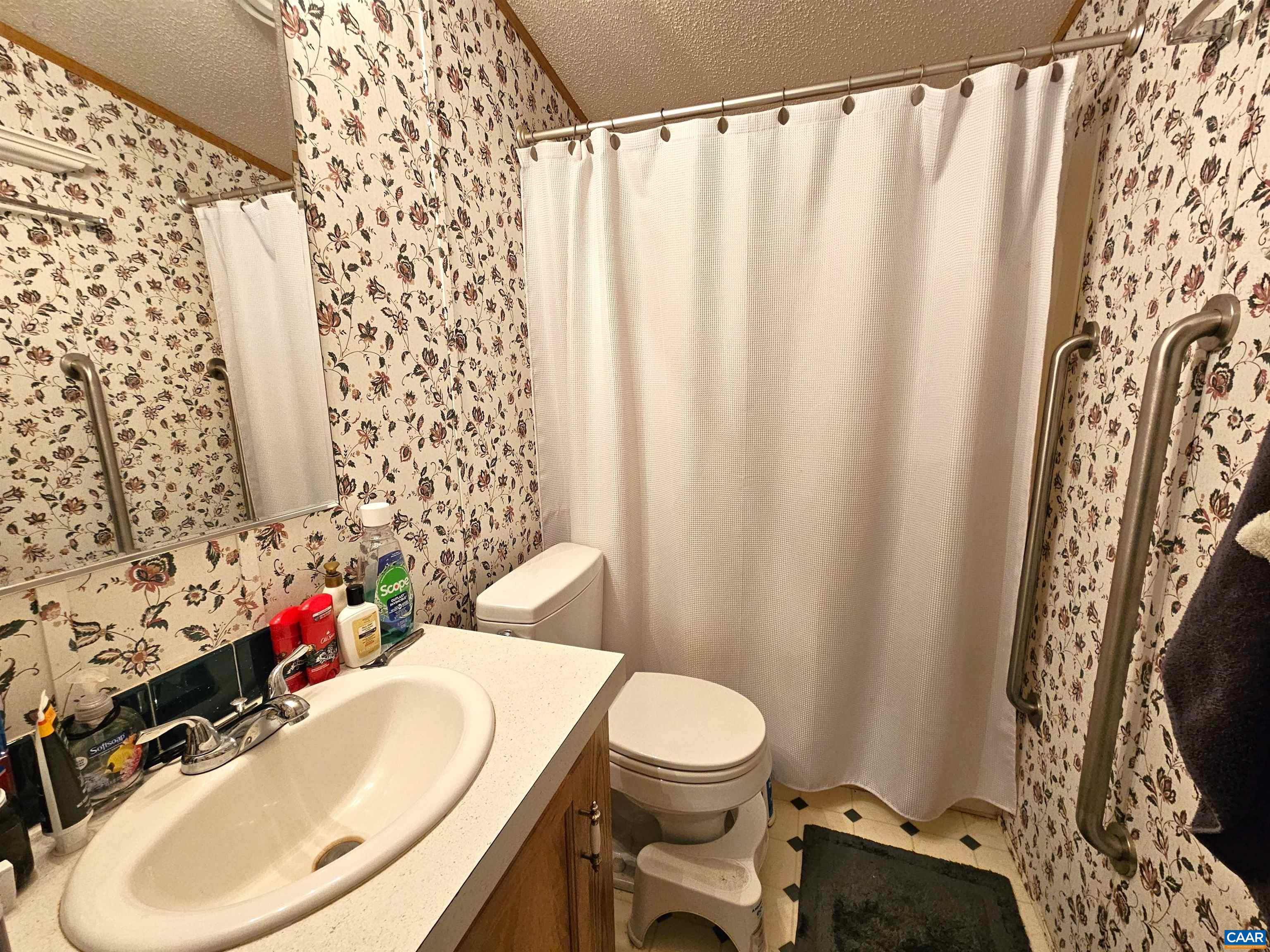 981 Scotts Bottom Road Dillwyn, VA 23936 - Photo 22 of 62 a bathroom with a sink toilet and shower curtain