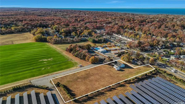 an aerial view of a tennis ground and a city view