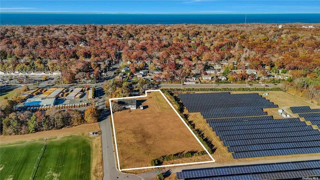 a view of a balcony with wooden floor and city view