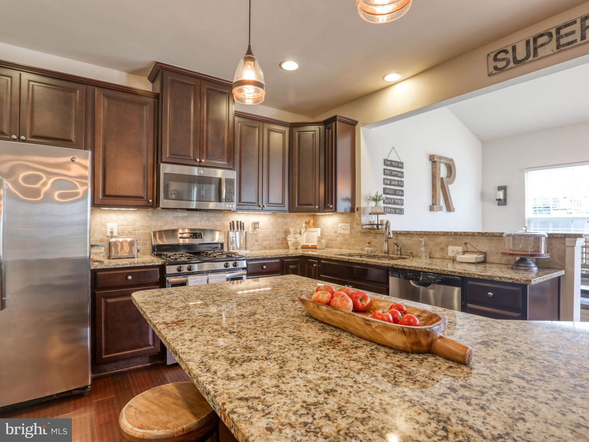 111 Pinwheel Court Stephenson, VA 22656 - Photo 14 of 43 Granite counters & stainless steel appliances