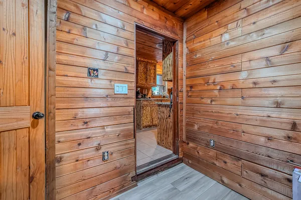 a kitchen with granite countertop sink and cabinets