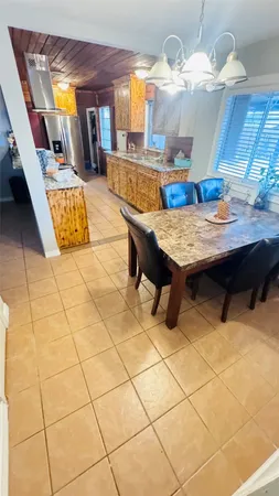 a dining room with a table and chairs