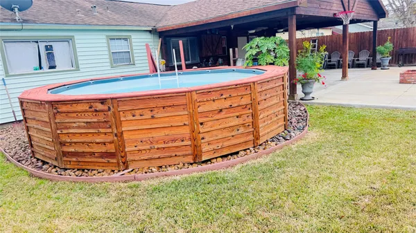 a house view with a seating space and garden