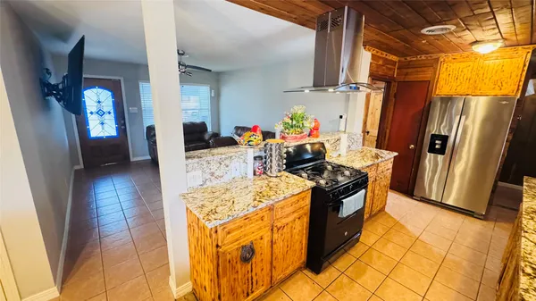 a spacious bathroom with a granite countertop tub a mirror and shower